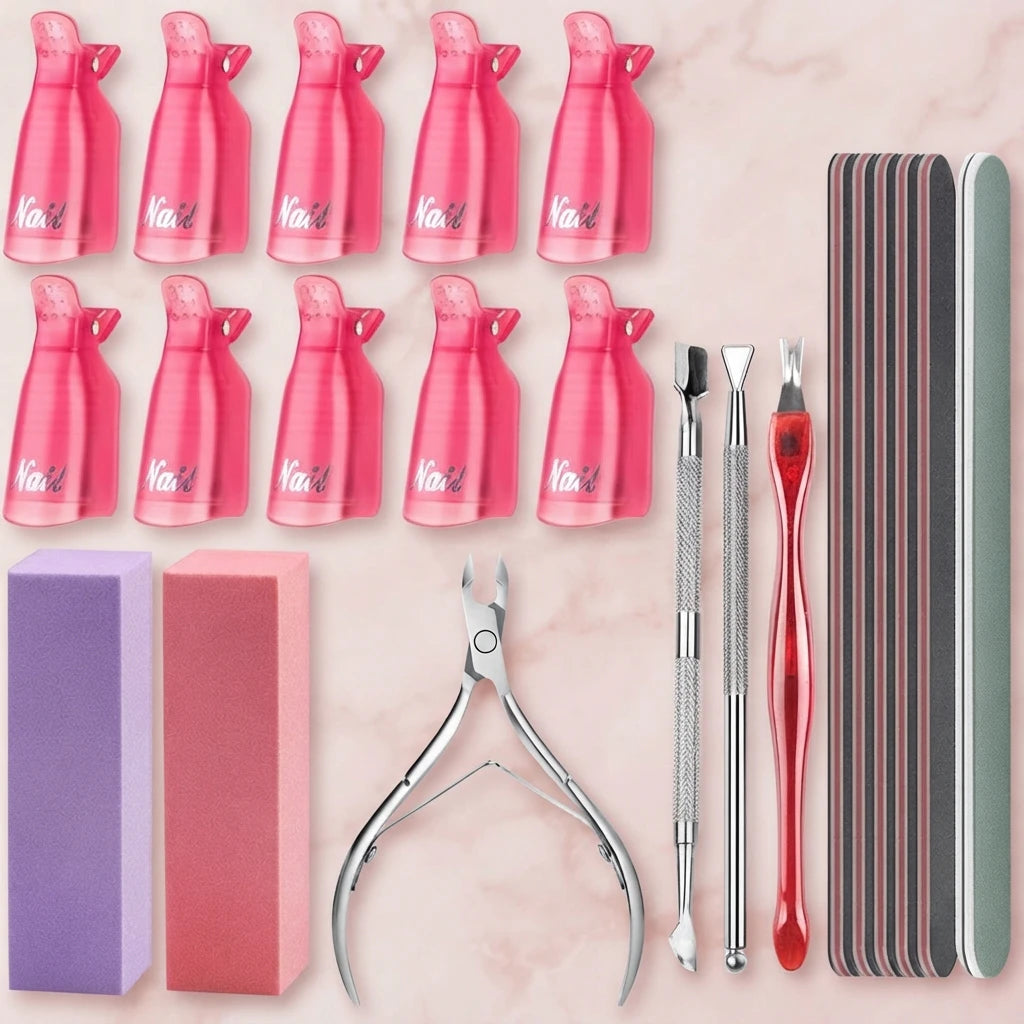 Nail art kit with pink bottles, purple and pink blocks, and metal tools on light background