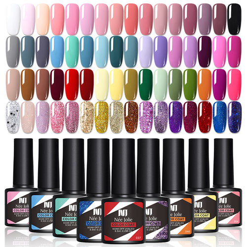 Gel nail polish color selection display with glitter and dark shades in bottles and swatches