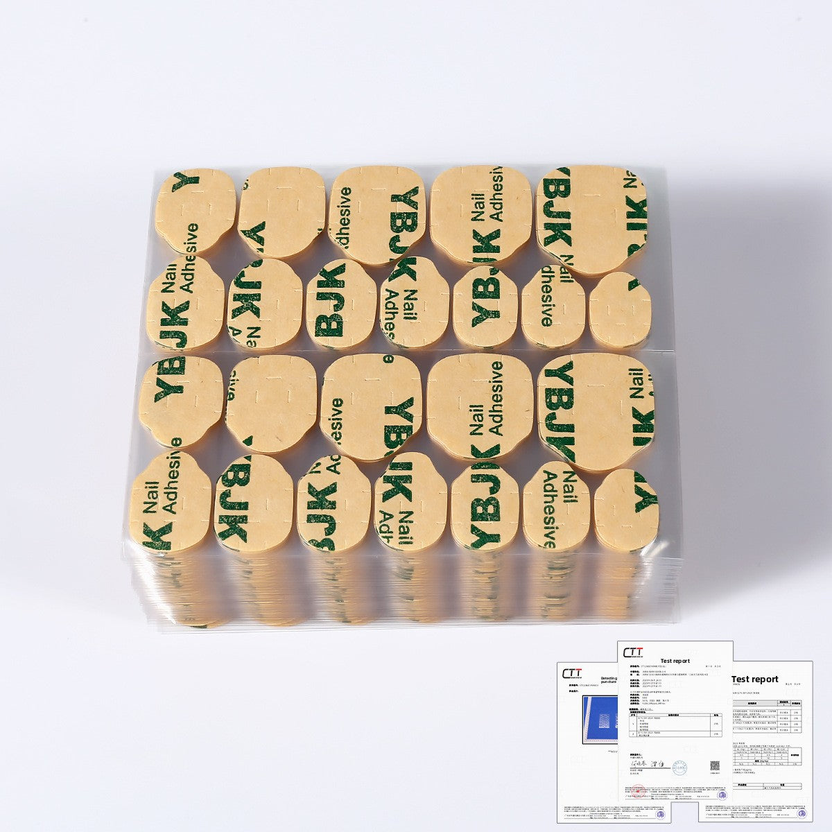 Nail adhesive jelly glue kit, full pack of gold-toned adhesive nail tabs in a tray