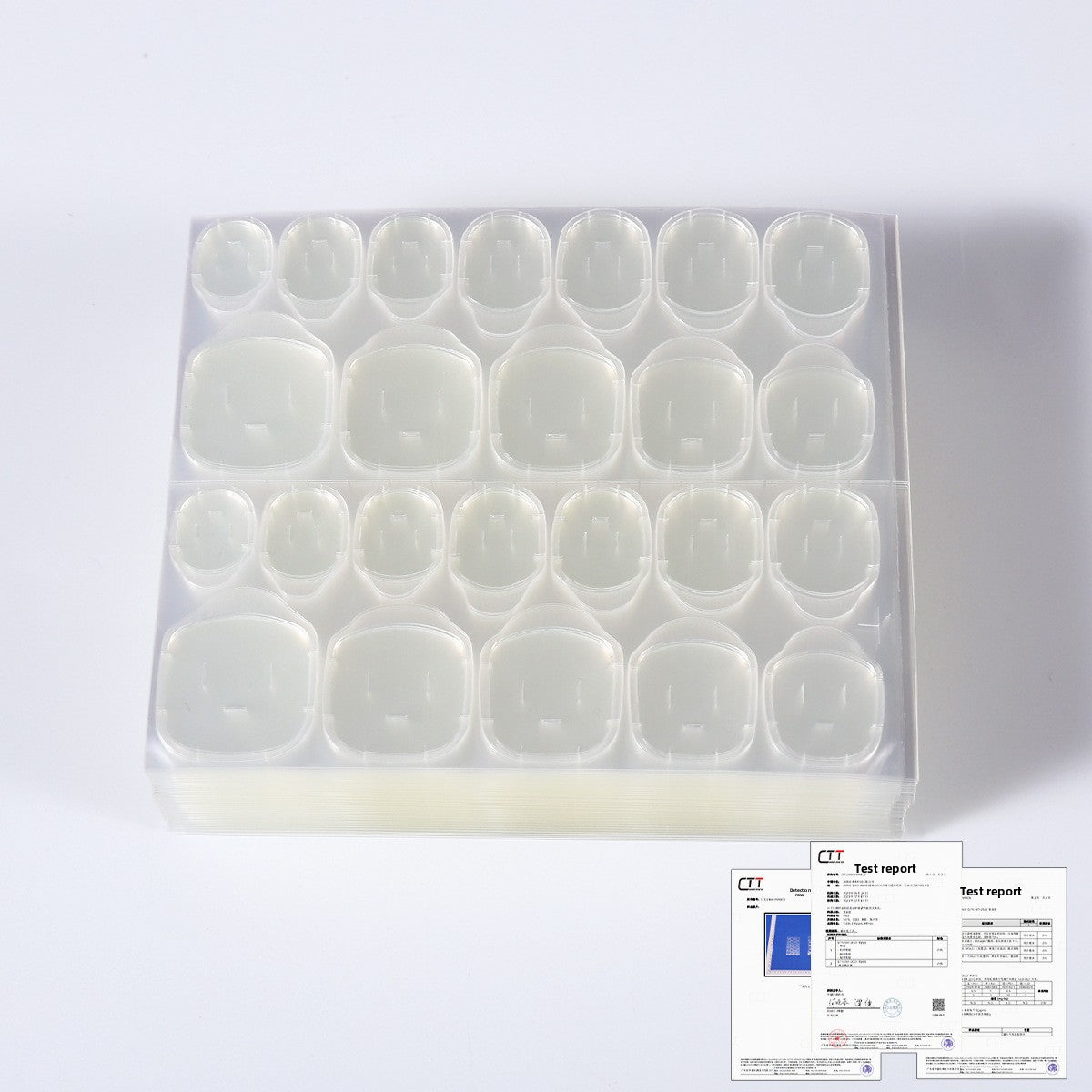 Organizer tray holding clear oval press-on nail tips, nail glue kit set