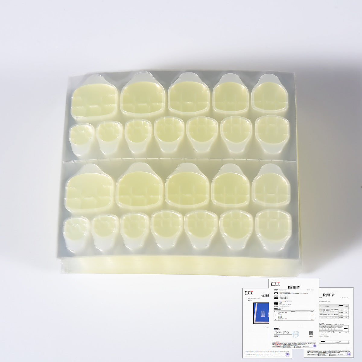 Nail gel glue kit pale yellow nail tips in clear tray, front view