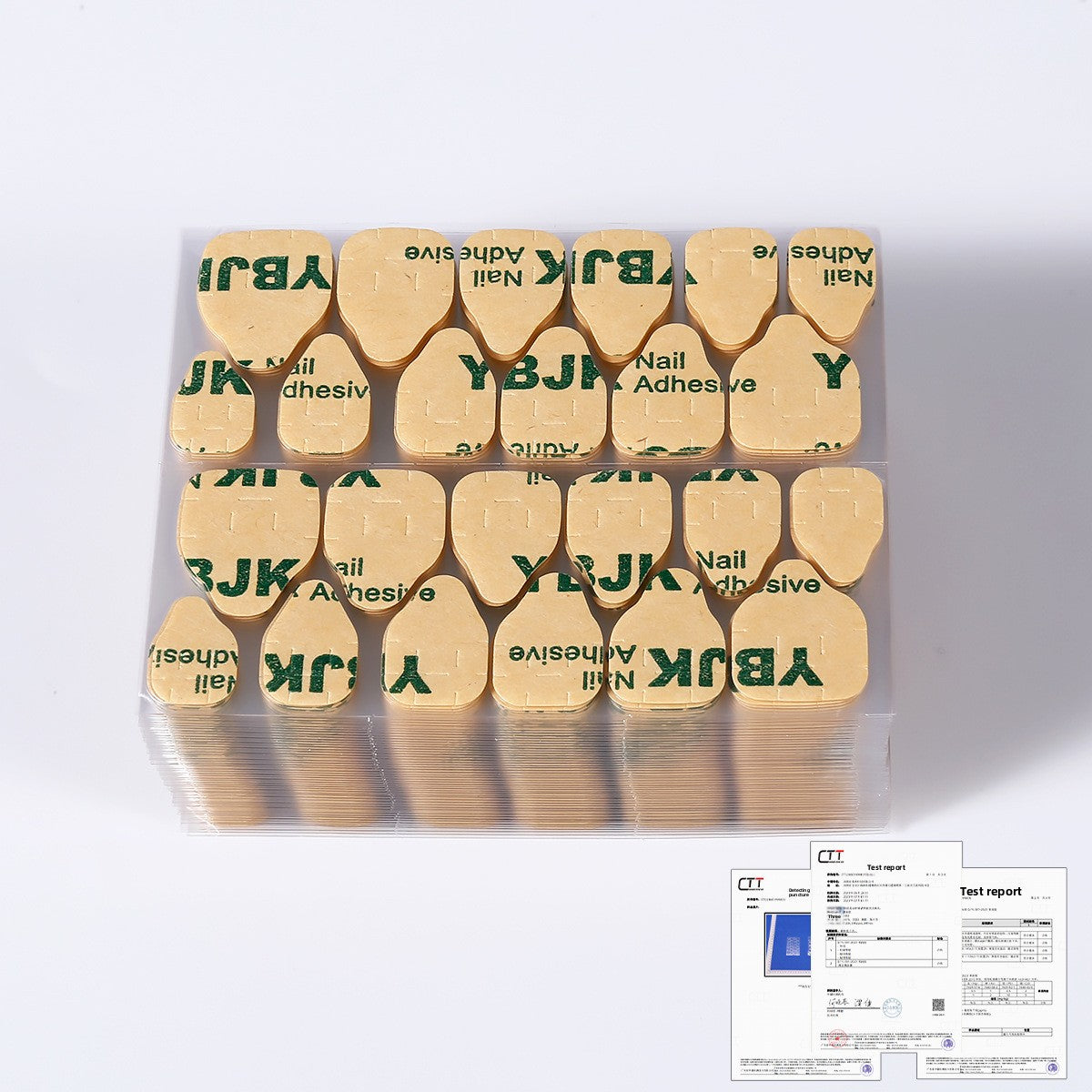 YBJK nail adhesive nail tips on gold backing in a plastic tray kit