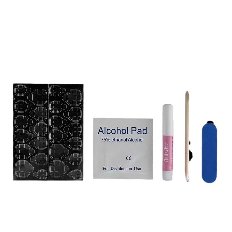 Press-on nail set with alcohol pad, glue, nail tips, and blue file block